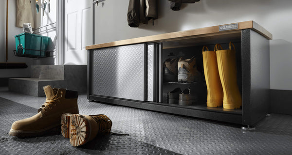 A Gladiator® Storage Shoe Bench with shoes in and around it.