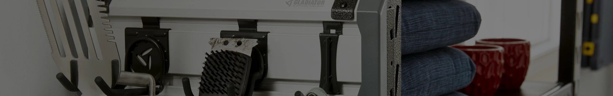 Tools and tape hanging on a Gladiator® shelving unit.