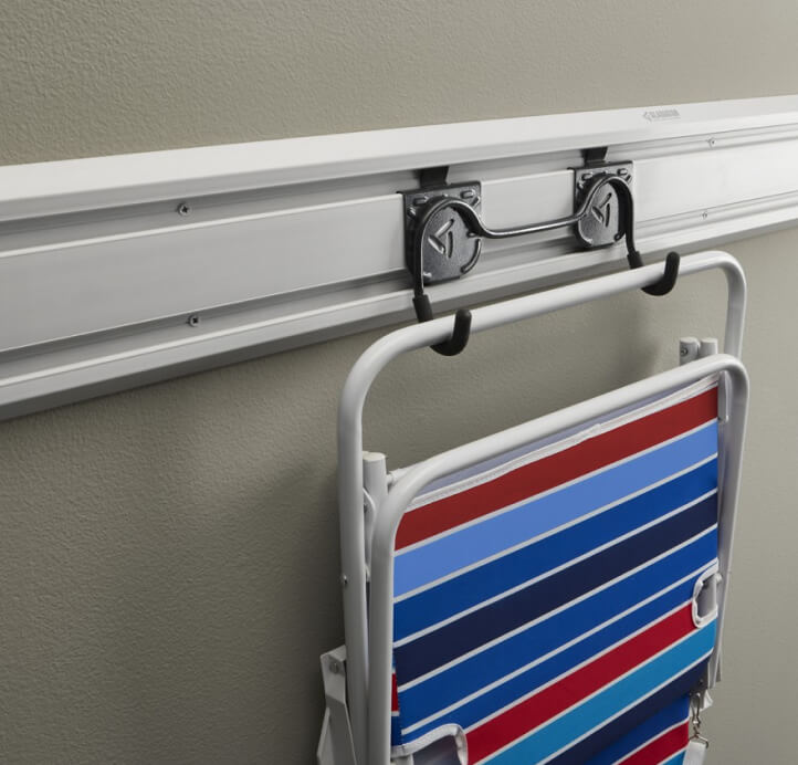 A lawn chair hung on two hooks on a Gladiator® GearTrack® Channel