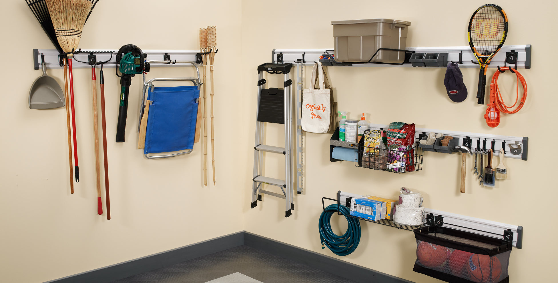Various lawn, sport and outdoor equipment hanging on Gladiator® GearTrack® Channels