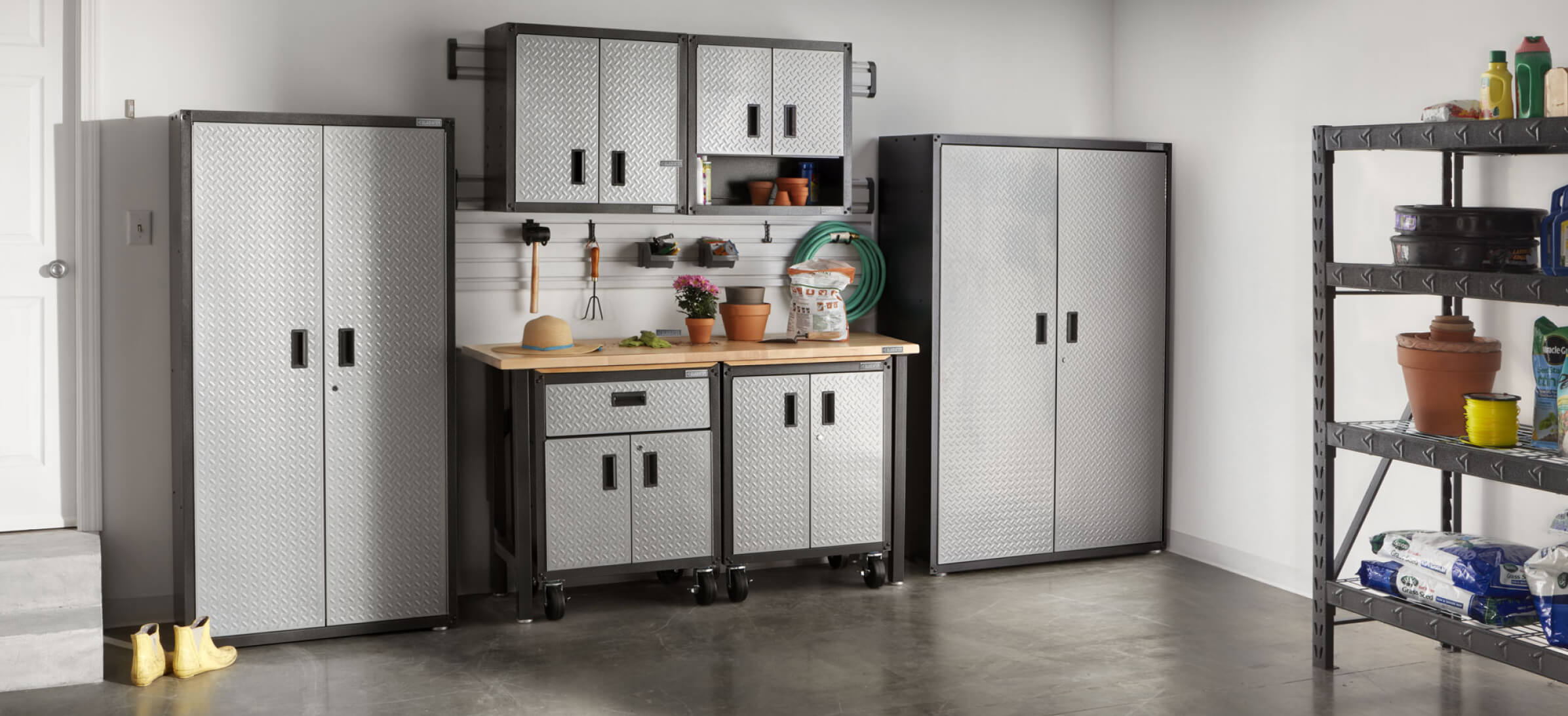 Close-ups of Gladiator brand garage cabinets installed in conjunction with workbenches.