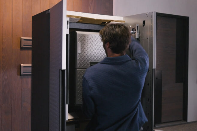 A man unpacking the Gladiator® Flex® Cabinet System.